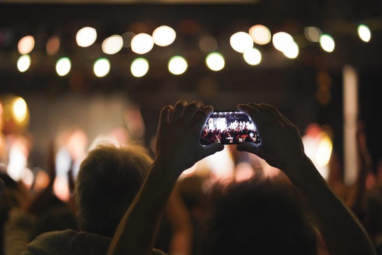 Person recording a video using smartphone